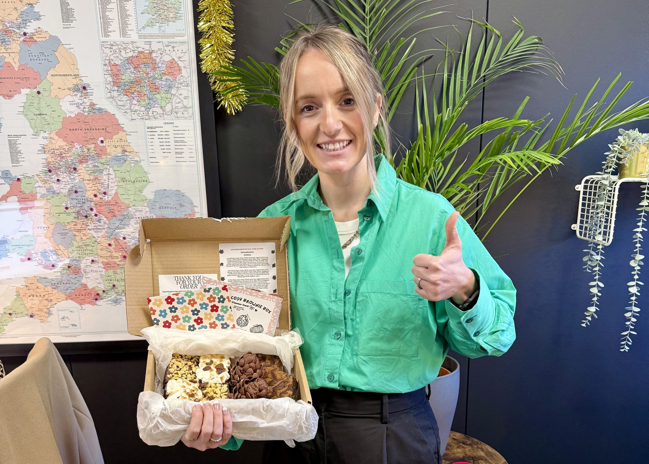 Atomic Consultancy – The Property Outlet Estate and Lettings Agent Aquisition Atomic Consultanct showing Laura Cooper Aquisition Director recieving gift after successfully helng The Property Outlet sell their estate and lettings agency